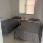 Slaapkamer 2 met twee eenpersoonsbedden in appartement Aqua Viento